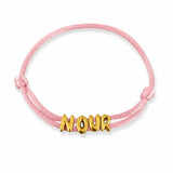 NOUR sliding name bracelet with Baby Pink satin cord on white