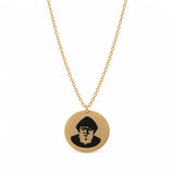 Gold-plated St. Charbel round pendant necklace on a white background.