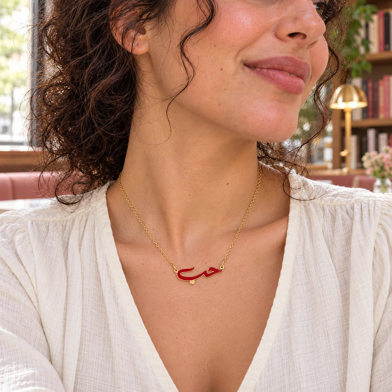Hob Arabic Love Enamel Necklace — close-up with the same model, outfit and setting