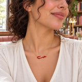 Hob Arabic Love Enamel Necklace — close-up with the same model, outfit and setting
