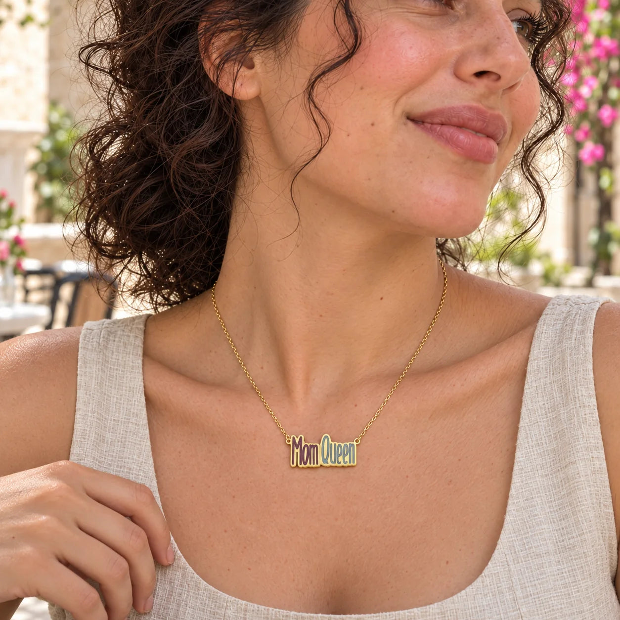 Mom Queen Enamel Necklace — close-up with the same model, outfit and setting