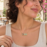 Mom Queen Enamel Necklace — close-up with the same model, outfit and setting